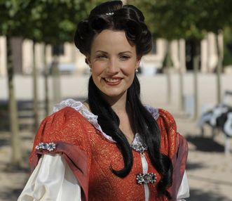 Costume wearers in the Favorite Palace garden